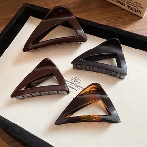 Set of four large geometric triangle hair claws in tortoiseshell and earth tones