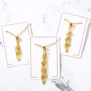 Handmade gold metal mesh necklace with geometric woven pendant for raw crystal stones