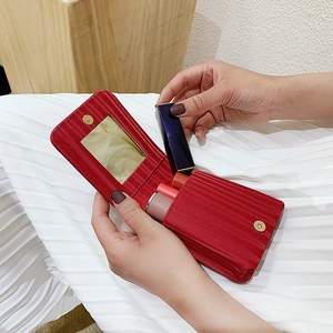 Mini red leather lipstick pouch with mirror and magnetic closure for three lipsticks