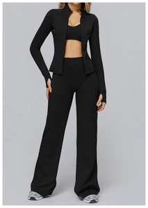 Close-up of black high-waist wide-leg sports pants with premium elastic yoga fabric