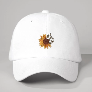 Close-up of colorful sunflower and butterfly embroidery on white baseball cap