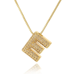 Detailed view of capital letter E pendant in gold finish with micro-inlaid champagne zircons