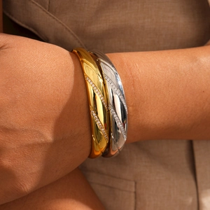 18k gold plated twill bangle set with zircon inlay on brown textured fabric