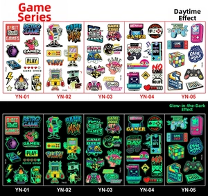 Macro detail of cartoon game-themed luminous temporary tattoos in daylight and night vision