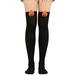 Halloween over-the-knee socks with orange pumpkin patches on black knitted fabric