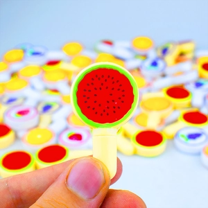 Close-up of novelty watermelon toy pen with vibrant colors and realistic fruit texture