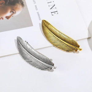 Leaf feather hair clips in gold and silver metal finish with detailed vintage texture