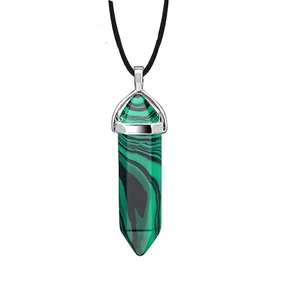 Detail of green malachite hexagonal quartz point pendant with silver clasp and black cord