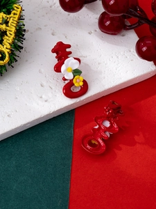Detail of red festive hair clip with Double Happiness shape and small flower accents
