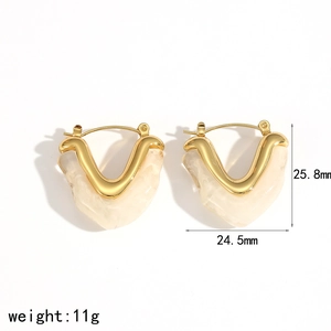 Detail view of heart-shaped resin earrings with size metrics and gold metal accents