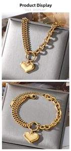 Detail of gold heart pendant bracelet with asymmetric double chain and K18 tag