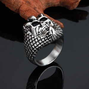Men's gothic skull ring in silver stainless steel on dark reflective background