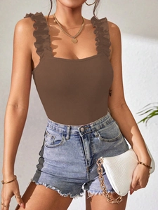 Close-up of brown ribbed knit bodysuit featuring elegant ruffle straps and texture