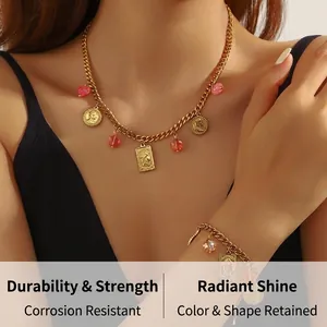 Detail of vintage gold stainless steel coin pendant necklace and bracelet set on model