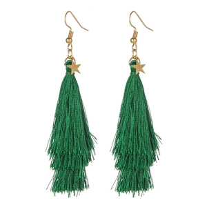 Detail view of handmade Christmas tassel earrings with green fringe and gold stars