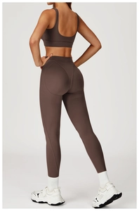 Rear view of brown high-waisted yoga pants with heart-shaped seams for booty lifting