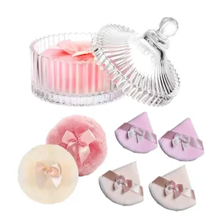 Glitter powder puff set with ribbon bows in a classic ribbed glass storage container