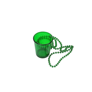 Close-up of a green plastic mini shot glass necklace for festive party decorations