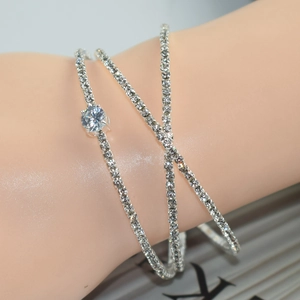 Macro shot of silver multilayer rhinestone bracelet with a large central round diamond