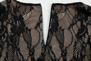 Close-up of intricate floral lace fabric with a high-quality hidden zipper detail