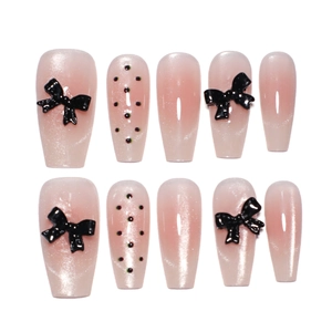 Pink gradient press-on nails with black 3D bows and glitter long trapezoid shape