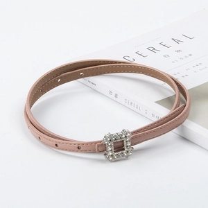 Elegant skinny leather belt for women in nude pink with a sparkling rhinestone square buckle