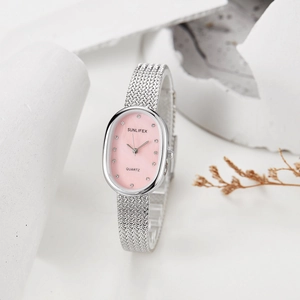 Detail of oval pink sunray dial quartz watch with silver Milanese mesh band and crystals