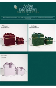 Detail of velvet gift boxes with silk bows in red, green, and purple colors
