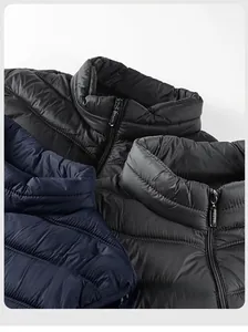 Detail of horizontal quilting on slim fit puffer vests with SPORT logo zipper pulls
