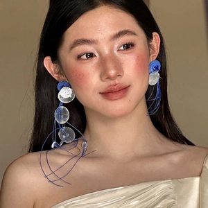 Exaggerated French style blue shell tassel earrings featuring long woven hoops and sequins
