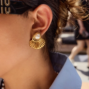 French retro gold fan-shaped stud earrings with large white pearl on female model