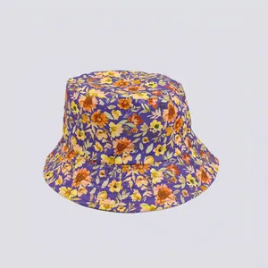 Detail view of purple floral bucket hat with vibrant sunflower digital print pattern