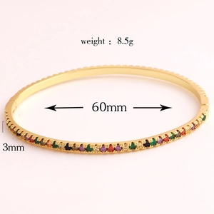 Detail showing 18k gold plated oval bangle dimensions with multi-color rhinestones
