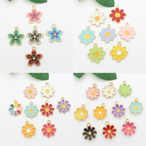 Macro view of colorful enamel flower alloy pendants with elegant gold plated frames
