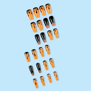 Halloween almond press-on nails set with orange glitter and black dripping paint design
