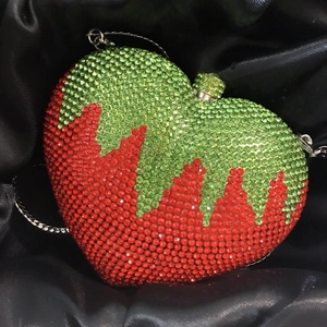 Sparkling strawberry evening clutch bag with red and green rhinestones and silver chain strap