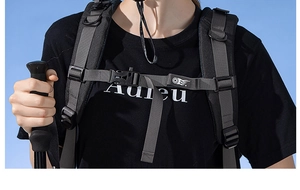 Detail showing adjustable chest strap with buckle on professional outdoor backpack