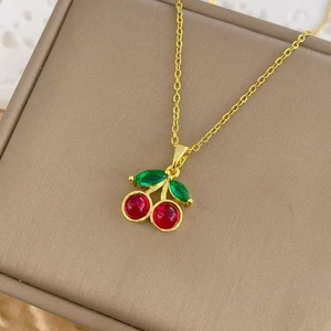 Sweet cherry pendant necklace in gold with red crystals and green marquise leaves