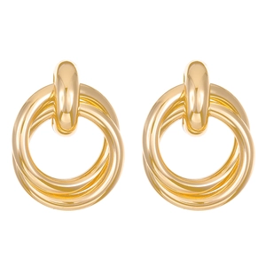 Exaggerated geometric gold hoop earrings with multi-layered nested ring design on white background