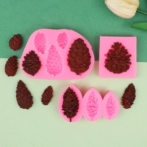 Macro detail showing pink pinecone silicone molds with brown textured fondant samples