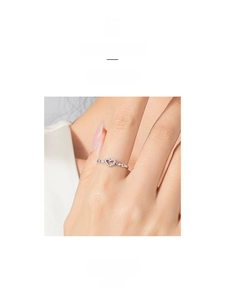 Detail of s925 sterling silver heart ring with sparkling paved pavé diamonds