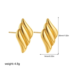 Detail view of gold wave stud earrings showing 26mm height and 14mm width dimensions