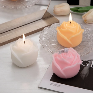 Handcrafted rose scented candles in white and pink tones for creative home decor