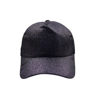 Detail of black glitter baseball cap showing breathable mesh back and sparkly texture