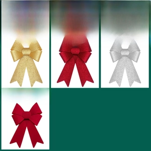 Detail of Christmas glitter and flocked bows in gold, red, and silver for holiday decor