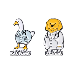 Cartoon doctor enamel brooches featuring white duck and golden retriever on white background