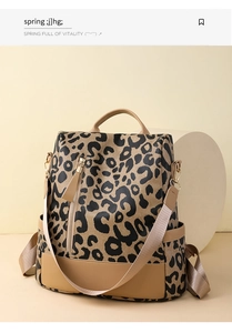 Detailed view of leopard print backpack with khaki PU leather trim and side zipper