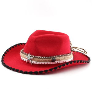 Detail of red cowboy hat with woven edges, star metal badge and multi-layer decorative bands