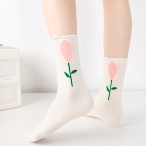 White crew socks with pink and green tulip flower pattern for casual summer wear