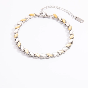 Detailed view of two-tone gold and silver leaf chain bracelet with adjustable lobster clasp